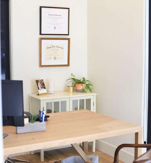Your family can enjoy the highest standard of care at Caldwell Dentistry Co Dr Office desk with a computer
